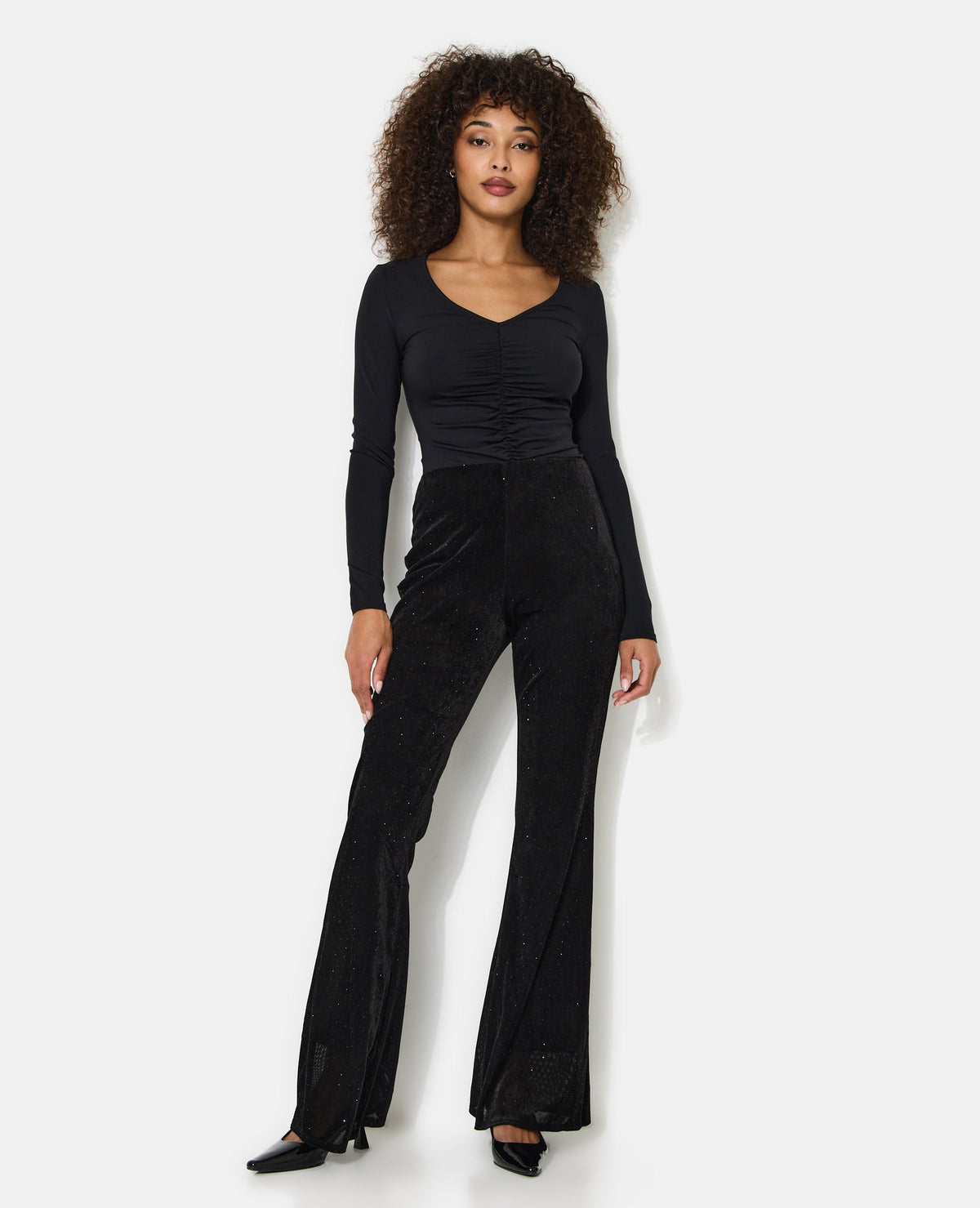 Pantalon flare en résille et velours avec strass