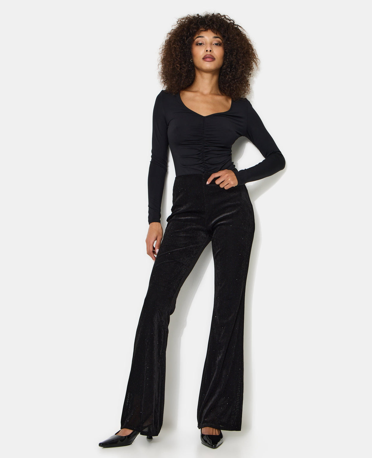 Pantalon flare en résille et velours avec strass