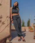 Pantalon bouffant en satin avec ceinture à nouer