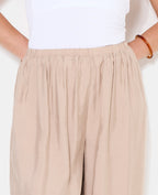 Pantalon bouffant en tissu satiné