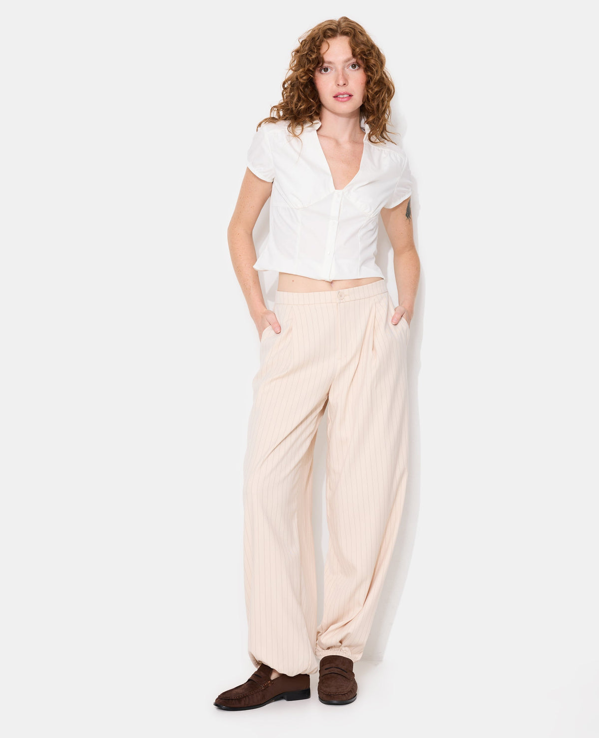 Pantalon bombacho avec rayures