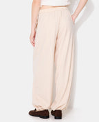 Pantalon bombacho avec rayures