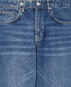 Jean wide taille basse avec patte boutonnée