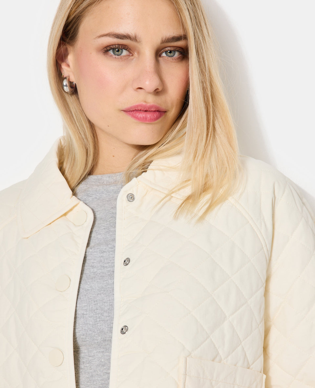 Blouson matelassé avec col et poches