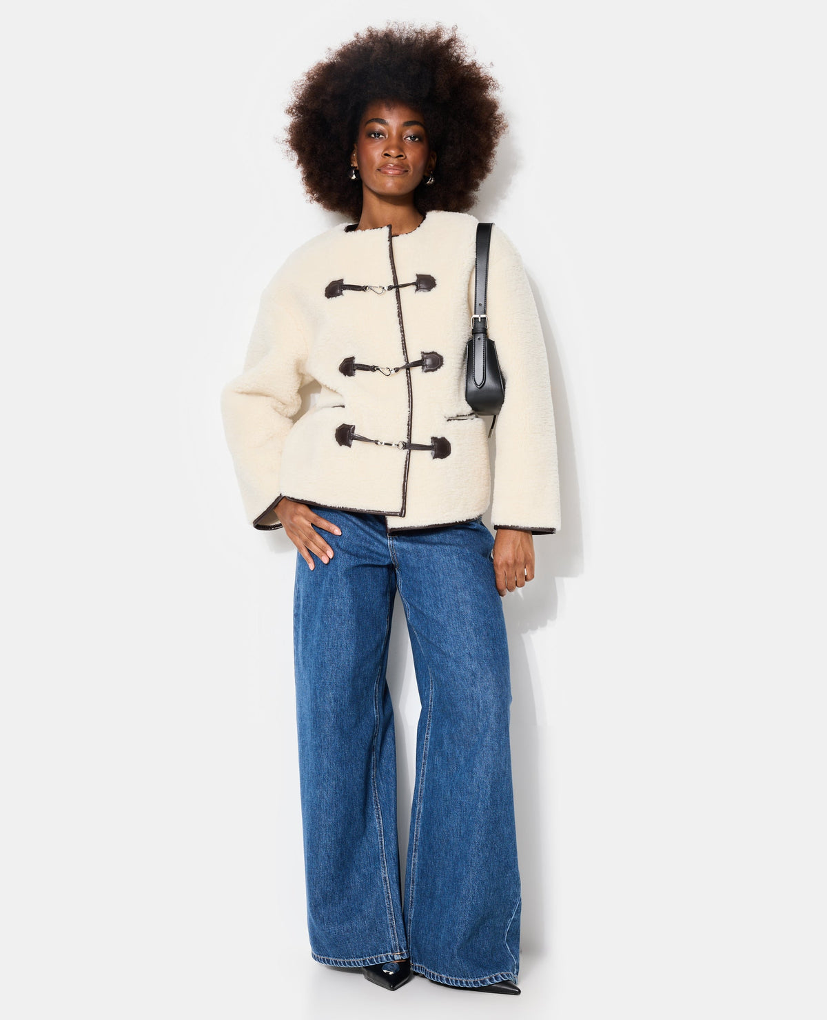 Blouson droit en sherpa avec attaches mousqueton