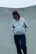 Sweat col polo avec poches et détails coupés