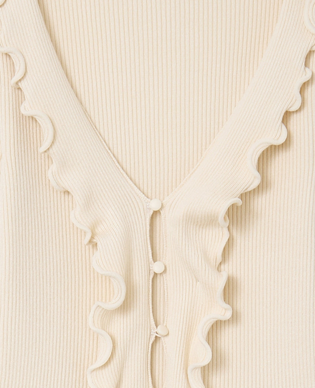 Gilet maille côtelée avec volants et bords ondulés