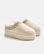 Mules en sherpa avec semelles compensées