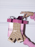 Paire de chaussettes à carreaux avec ourson